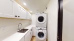 Laundry room with detergent and dryer sheets provided 
